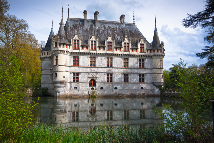 Azay-le-Rideau, France - April 26, 2012: Panoramic of Azay-Le-Rideau Chateau standing in the centre of a romantic park, this masterpiece of 16th-century architecture has preserved, with the passing years, all the refinement, elegance and grace of an exceptional Renaissance Chateau. On the Unesco World Heritage list.